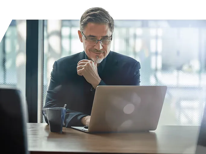 A trader thinking at his laptop
